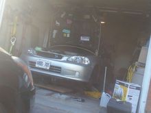 Getting ready to drop the engine out of the buttom,  my crane is currently stuck behind the car anyways :p.