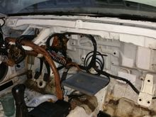 Stripped out the stock wiring/fuse boxes and fabbed in a metal battery tray for a full sized battery under the dash.