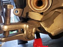 Used a ball joint separator to push the sleeve off.