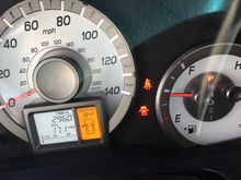 After 296 miles since filling up, the fuel gauge should read less than 1/4 full as 17.3 gallons has been consumed in a 21 gallon tank.