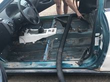 I can't even handle working on cars that gross, so the first thing we did while the battery was charging was took out the carpet. We cleaned the inside pretty good, and tossed everything. The truck was the worst....