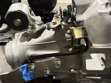 Bought this side mount where the reverse selector wire connects to and the OEM clutch line mounts to, I actually already had one in 