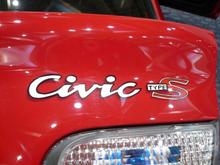A closeup of the painted Civic and Type S logos.