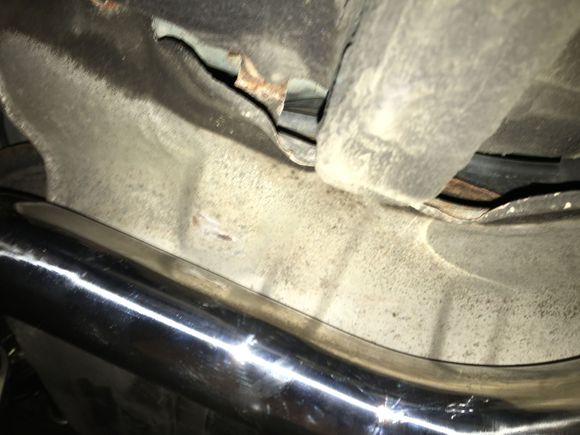 S-pipe pushed against the heat shield