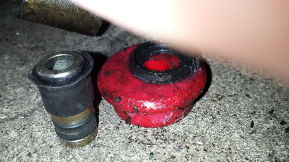 this is the entire old bushing next to 1 side of the new bushing