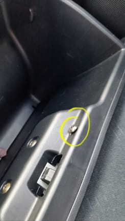 Locate the light switch inside the glovebox. Wet the contact point on the switch with a dab of petrolium jelly. Close the glovebox fully (push in on it). Open the glovebox. Find where the petroleum jelly made contact with the lid. Drill a hole there and insert a screw.  I used a 1/8 inch panel screw from a junkyard Honda.