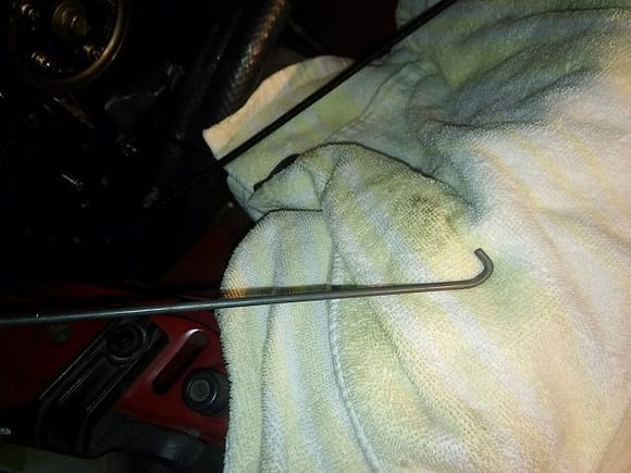 Hooked Rod used to pull on timing belt tensioner.