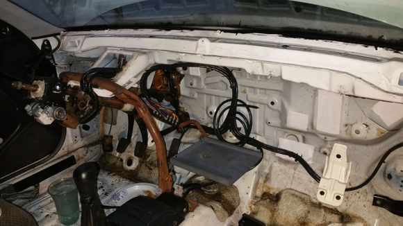Stripped out the stock wiring/fuse boxes and fabbed in a metal battery tray for a full sized battery under the dash.