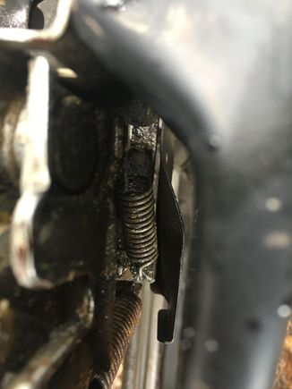 Tension spring for hood cable.