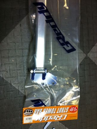 Also pick new in package, a front Greddy strut bar to replace the oem one