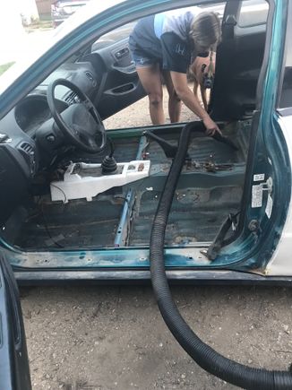 I can't even handle working on cars that gross, so the first thing we did while the battery was charging was took out the carpet. We cleaned the inside pretty good, and tossed everything. The truck was the worst....