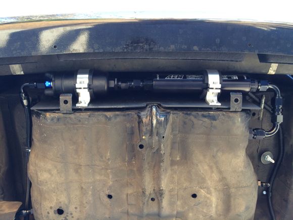 Tucked behind the rear bumper