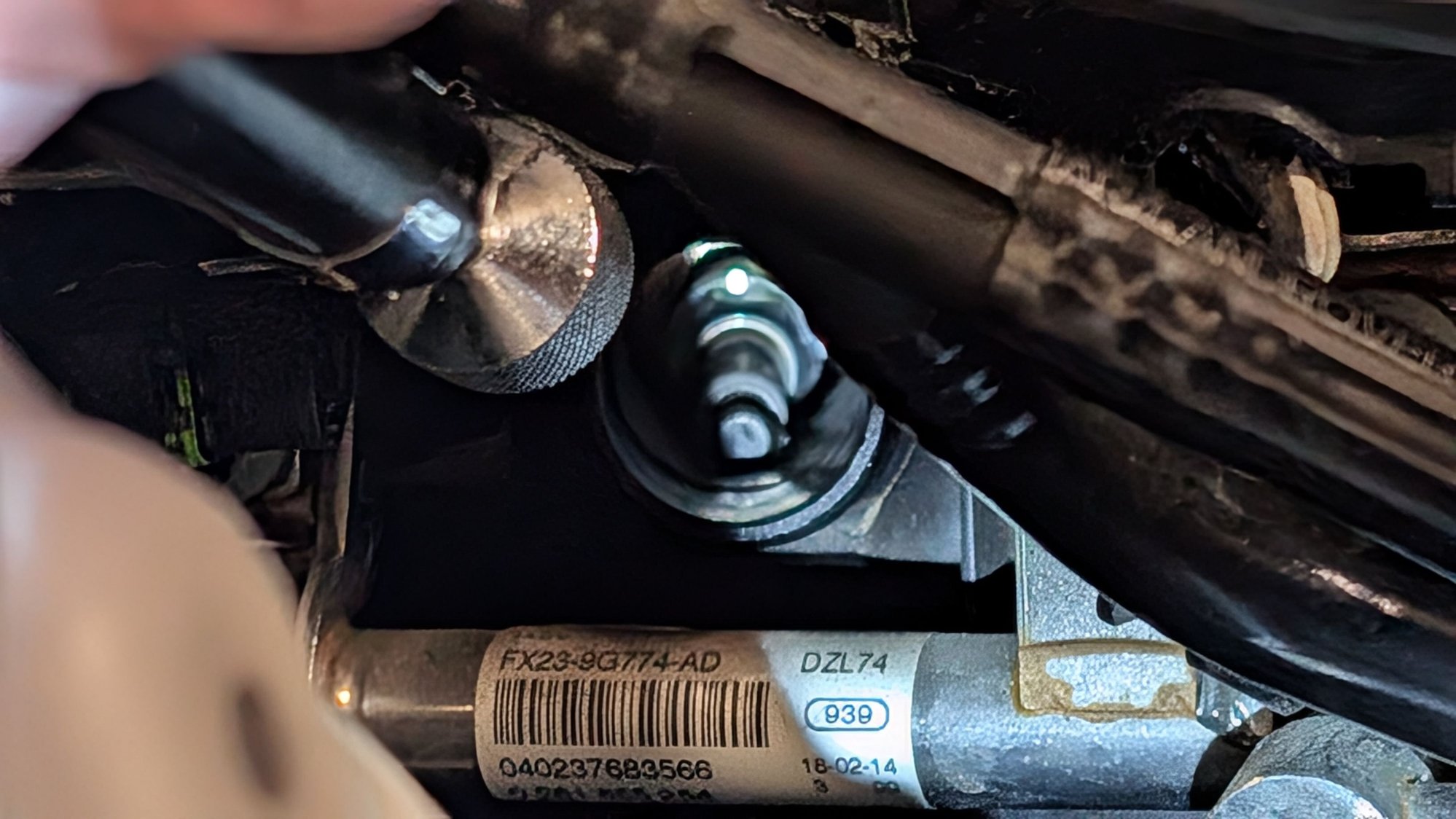Grab it with a magnet when it's fully unscrewed!