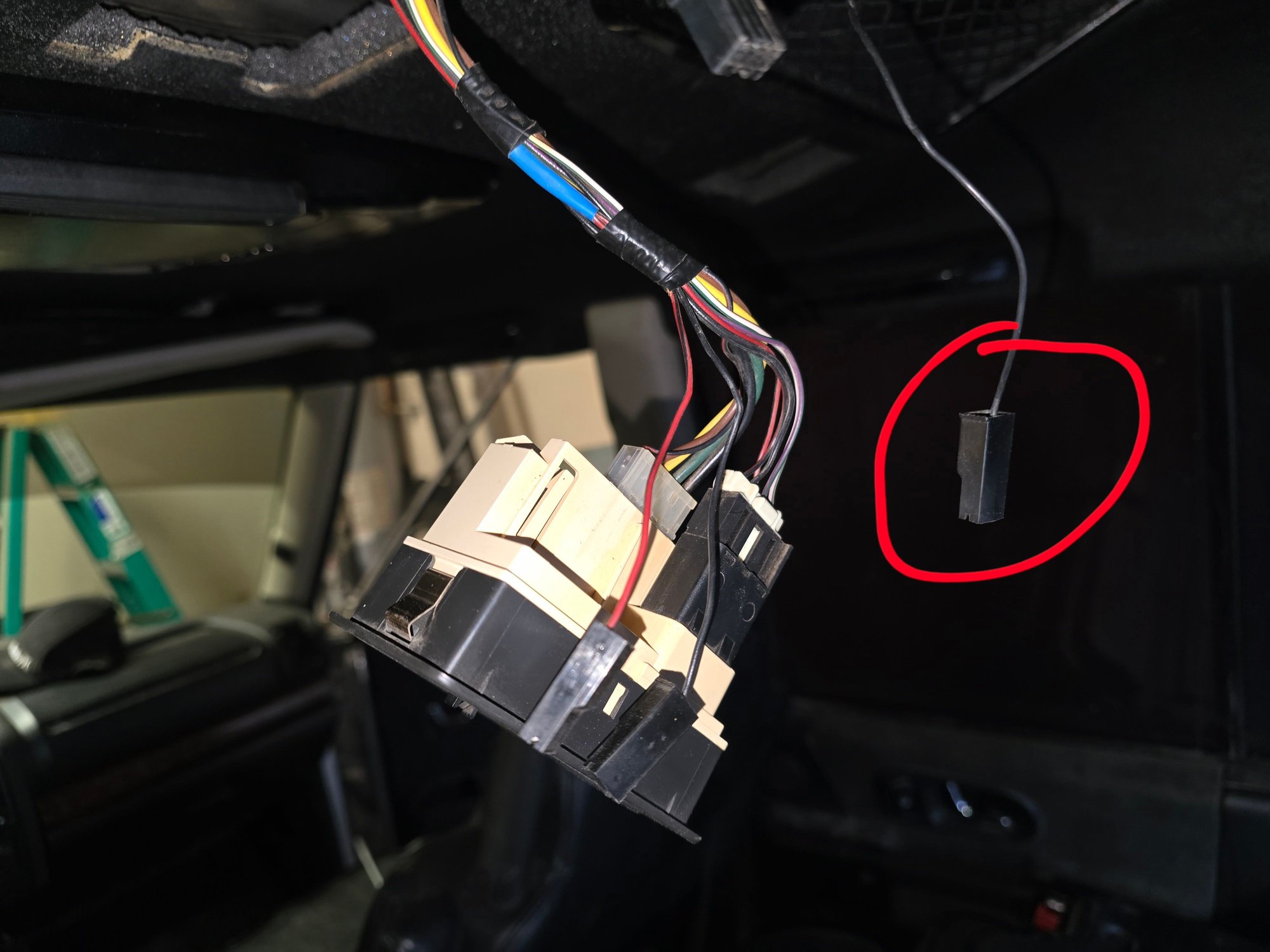 The harness clip at the very top clips into the domelight. The circled clip does not have an obvious connector to attach to. 