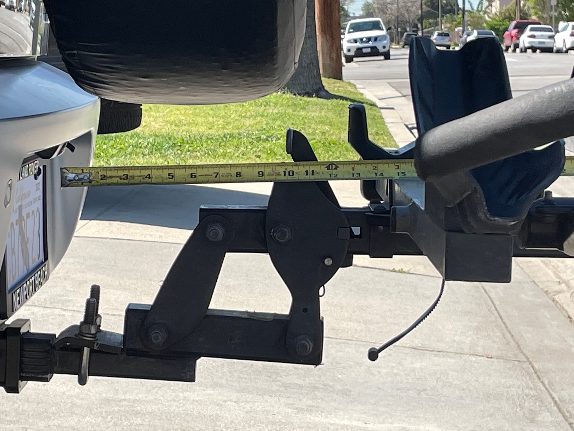 I measured the distance with the rack in place. (The bikes could not be mounted on the rack due to the spare). I selected a 8.5� extender based on the width of the bike so the peddles cleared the  spare. 