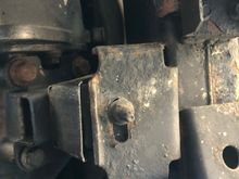 The transfer case mounts are pretty far back. Rear of truck is top of photo.