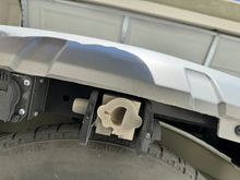 You can see the trimming on the underside of the bumper, it also makes a full size spare probably a tighter fit. 