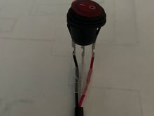 Nilights illuminated rocker switch, to be replaced by Discovery CC switch. It has 3 wires, red, white and black.  Red and white are connected when the switch is activated.