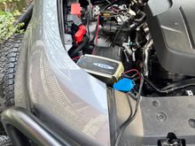 Charging. Confirmed I can lightly close the hood, route the cable generally speaking there,  and lock the car.  I leave the charger underhood because it’s not necessarily waterproof (is it) and it’s outside in this instance. 