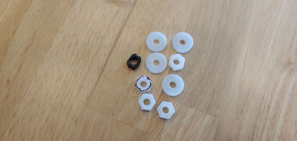 Assorted nuts and washers, you can see that the nuts were the best option interms of being closest before modification