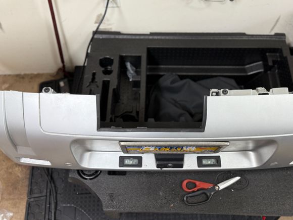 I cut my own bumper to accommodate the tow hitch.  I used sticky rubber trim to a