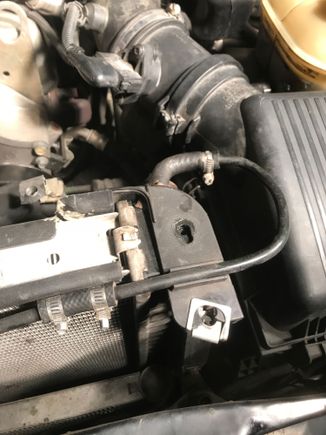 Nasty jb weld on the entry point to radiator, hose crack fix in between