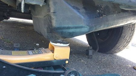 Step 14c Using Helper or a handy jack gently lower the tank from the left