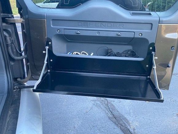 Very simple and straightforward design.  Does not block access to the rear pockets.   I will be interested to see how it gets used ......