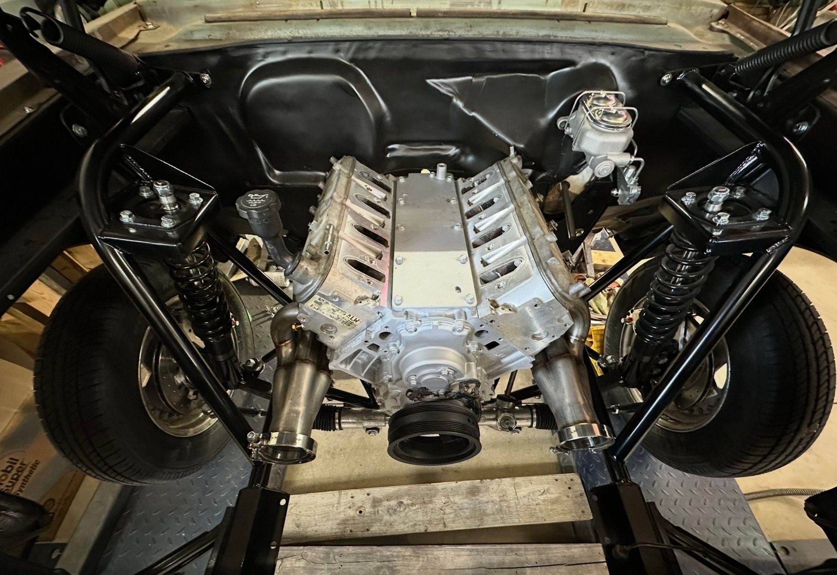 Got the 6.0L and 4L80E transmission installed today, this added weight set the front end down where it should be now