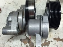 LS1 tensioner (left) vs. L99. Both come stock with a ribbed pulley; I installed the smooth one for my application (and will do the same with the L99).