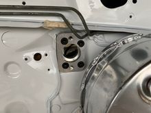 The holes are drilled and the bolts are in.  The silver paint on the booster is a little dinged up from the drill.