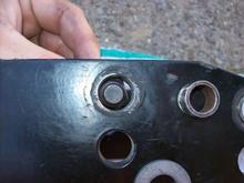 as you can see the 1/2 bolt is much smaller than the 14mm bolt hole drilled for all tq arms