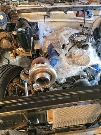 The ac condensor is installed, as well as the evap core, heater core etc. Turbo is mocked up. I believe i had to move it over some more because it was hitting the water pump outlets.
