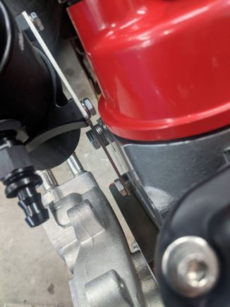 Washers to space out catch can to clear valve covers