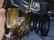 Pic: Genuine oem FRONT shock boots for '03 Nissan Maxima SE 3.5L part #54050-2Y001 with (2) rubber ribs. 