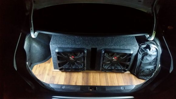 Wood floor and trimmed out around the box and moded light to led strips on both sides all done by "Shock Customs"