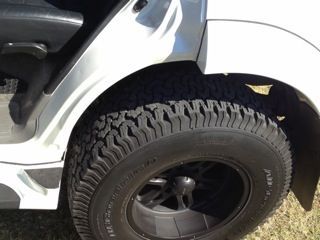 When you open the door, you can see where the original car ended.  The new tires widen the stance by over 10 inches.  And in accordance with Icelandic law, your fender flares must cover your tires.  Very considerate not to throw your mud on others.  The new width eliminated the Montero's notorious top-heavy feel.