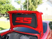 Trunk lid liner after dying the letters red, to match the body color.