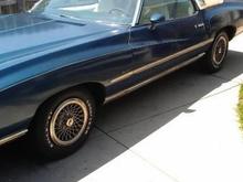 Has original hub caps and Goodyear Eagle ST tires