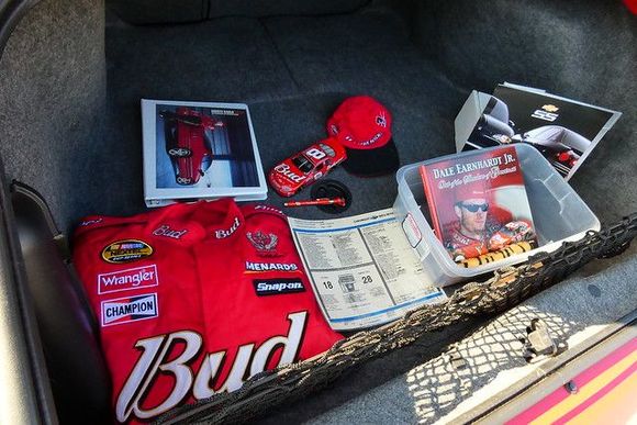 All original manuals, original sales literature, a Dale Jr. book with CD, Dale Jr. racing jacket, cover and other memorabilia.