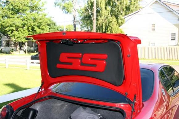 Trunk lid liner after dying the letters red, to match the body color.