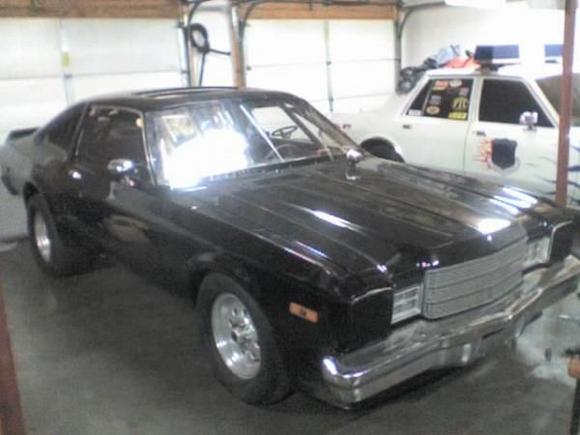 my 77 roadrunner 440 big block race car beside my83 dodge copcar race car.