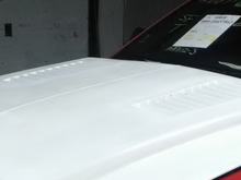 This Hood had louvers in it which were open to the engine compartment I don't like that on the streetcars and these louvers were also poorly made. 
I cut them out and put new fiberglass in to make that section of the hood smooth and closed