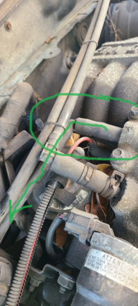 PIC 1 - rear passenger side intake manifold - single vacuum line, 90 degrees right to unknown device. 