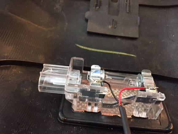 I just roughed up the housing and soldered a couple of wires to the trunk bulb.