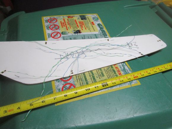 Bell wires cut to about 14" each and ready for threading into the hole pairs