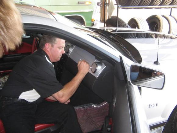 Chip Foose signing cars at the Last Ciener-Woods Ford Mustang Show.  That's one of my customers cars. 9-07