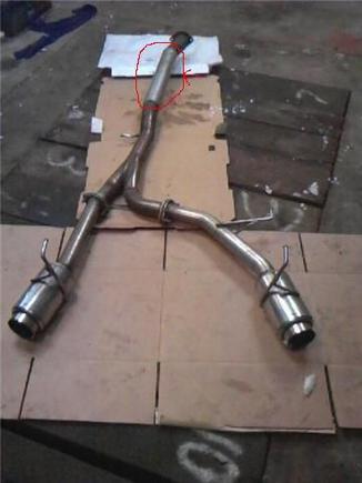 tanabe racing medalion the are circled and pointed to is where a resonater use to be until it got smashed so i welded in a peice of pipe non leaks comes with bolts and gaskets..... loud!!!!!