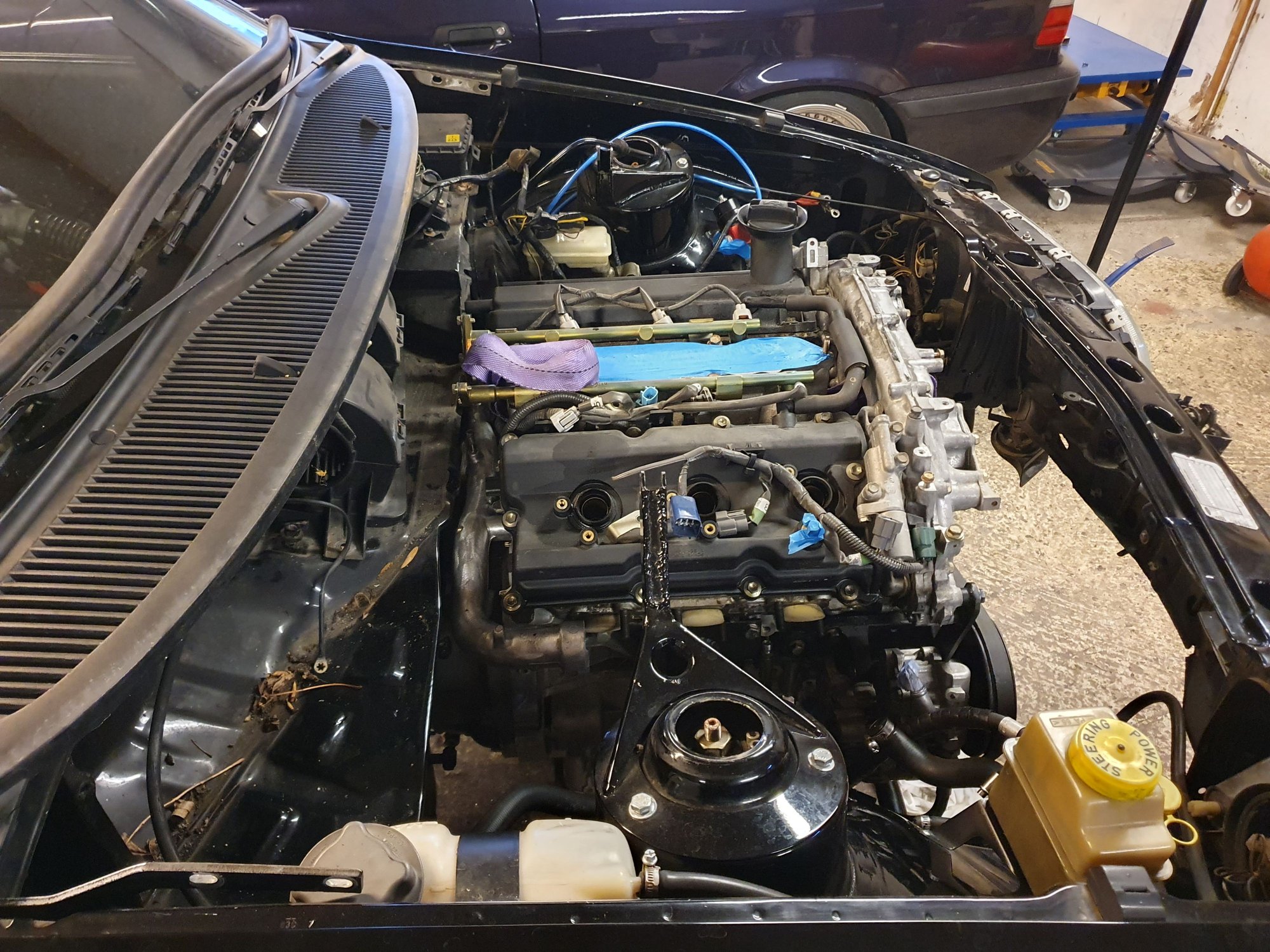 Engine tucked tight against the firewall. Now in the car it is supposed to be in.