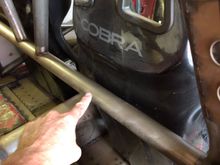 This bar stops the seat coming back about 4 inches so I could not straighten my legs in the car.   I will probably put in a moving tilton pedal box.